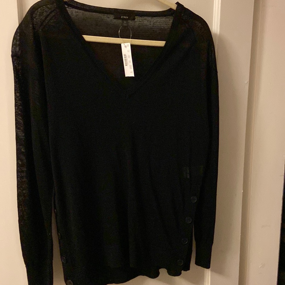 Brand new with tags. J. Crew sweater. 4 buttons down the side of the sweater.